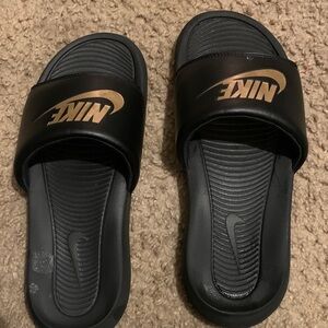 Nike Black Slides with Metallic Gold Swoosh